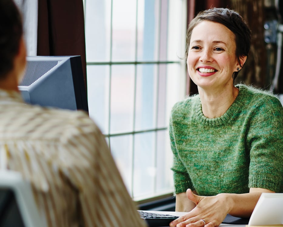 female employee talking to coworker