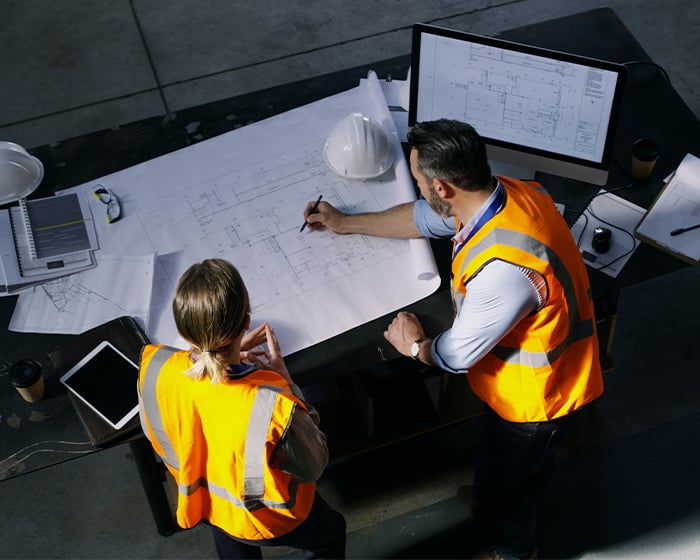 Engineers looking at plans
