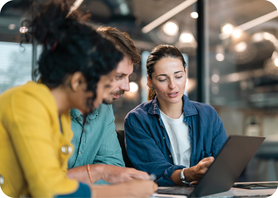 three coworkers looking at a computer