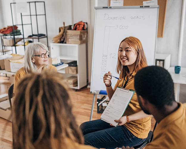 nonprofit employee presenting information in a meeting