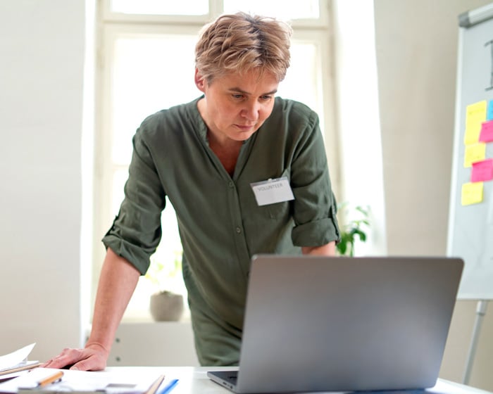 volunteer looking at laptop