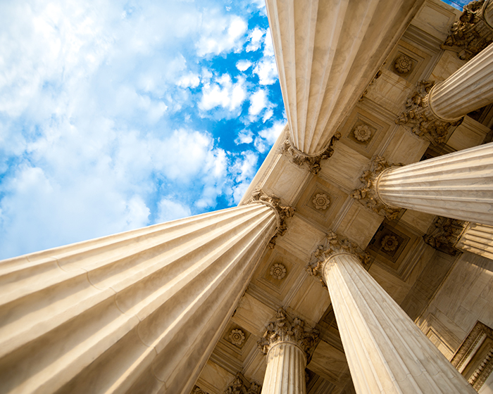 pillars from government building and blue sky