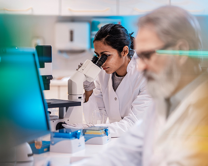Researcher or scientist using equipment