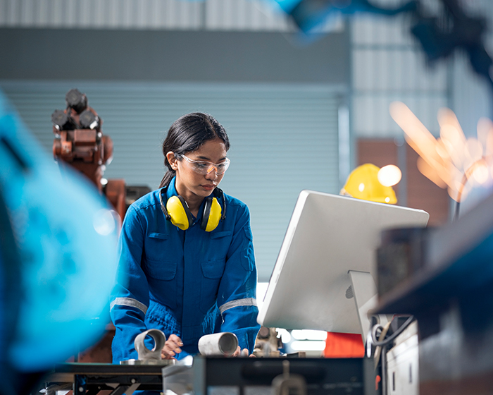 woman working on manufacturing line