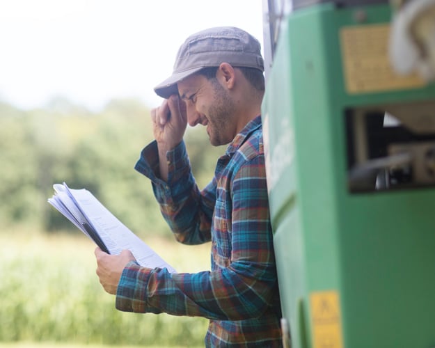 Farmer looking at Ag financials
