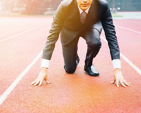 man-in-suite-getting-ready-to-run