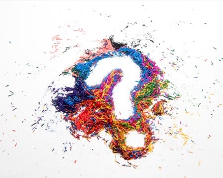 Pencil shavings in the shape of a question mark