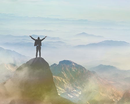standing-on-a-mountain
