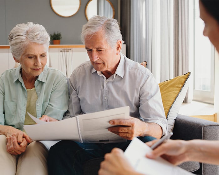 older couple looking over papers