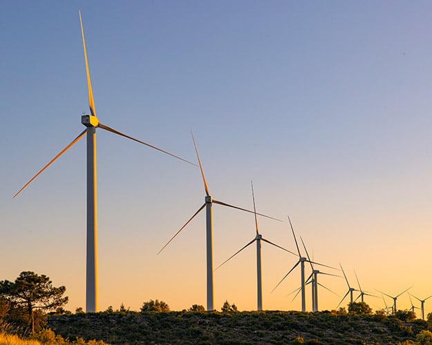 Wind turbines at sunset