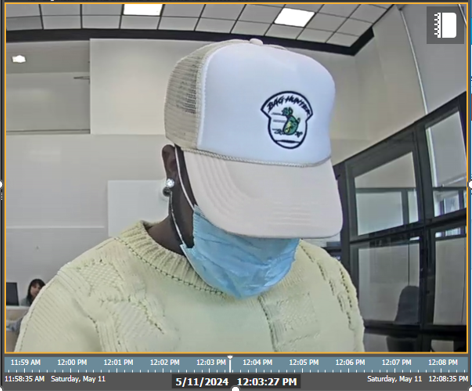 Alleged Fraudster wearing Bag Hunters logo apparel