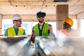 three construction employees using vr headset