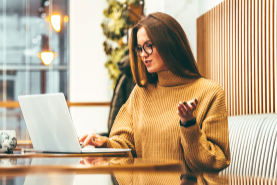 woman looking at laptop