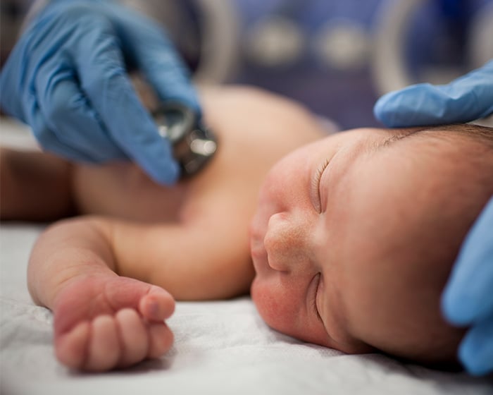 doctor checking a baby's heart