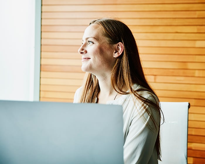 woman smiling and looking away