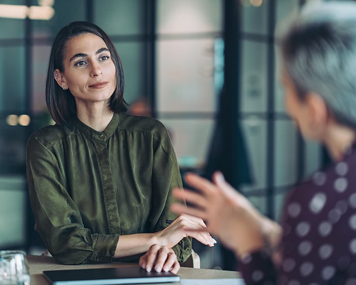 Focus on a female entrepreneur during a meeting