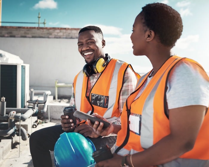 Two construction workers taking a break while on a jobsite