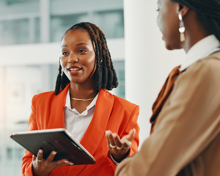 woman holding a tablet and talking