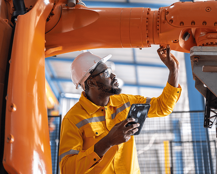manufacturing employee working on a machine