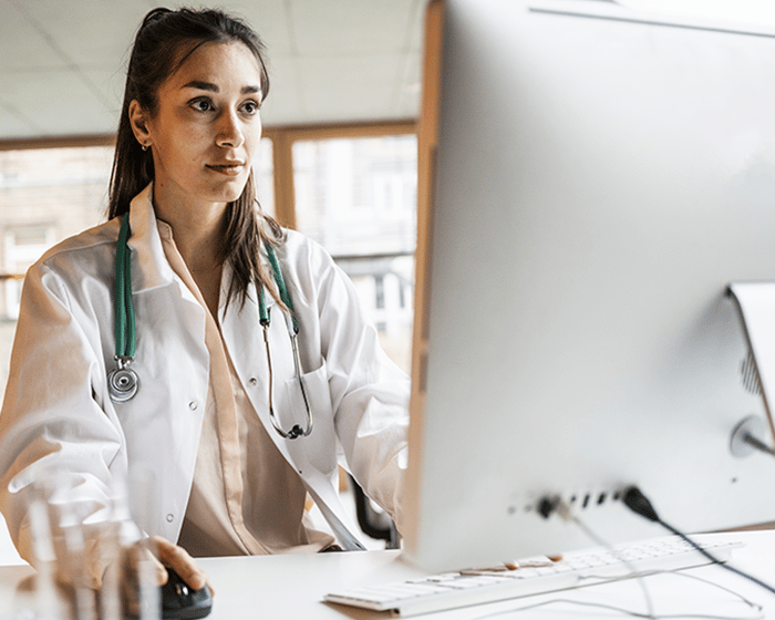 Female MD at desk