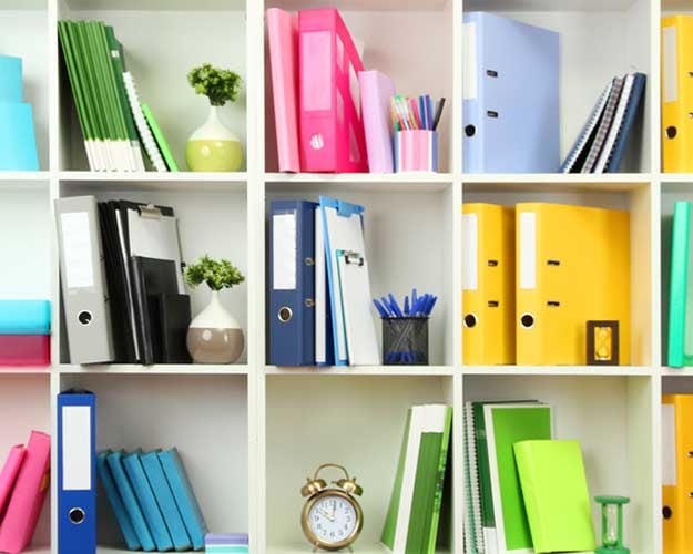 colorful folders organized on a shelf