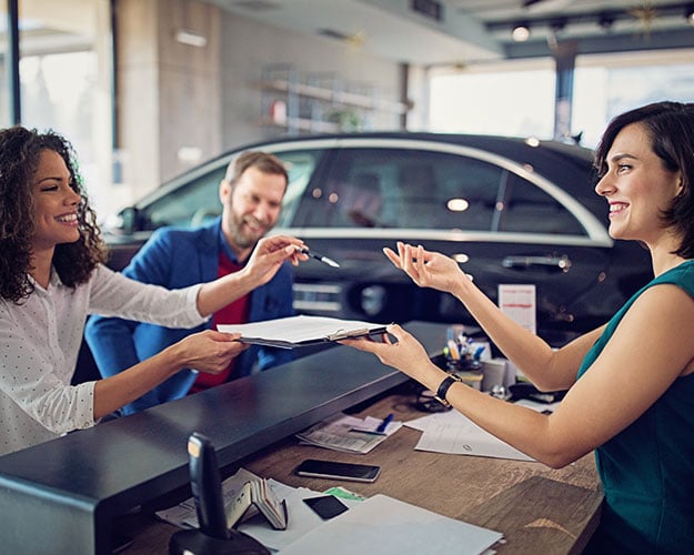 paperwork buying a car dealership