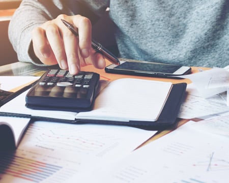 Man using a calculator