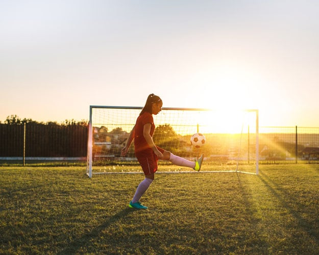 Women's soccer player on training.