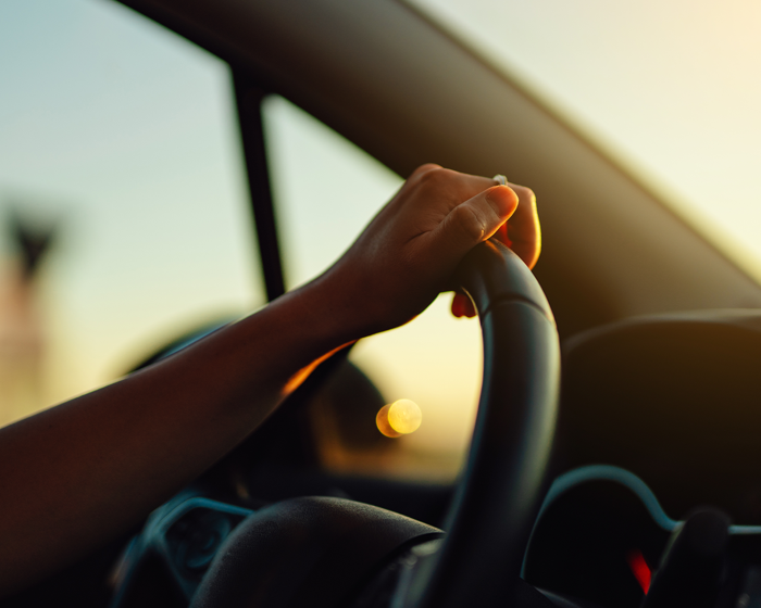 hand on steering wheel