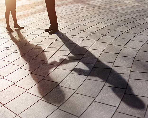 shadows of 2 people talking