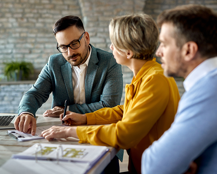 three people in a meeting