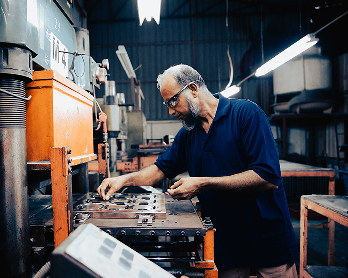 man working on manufacturing line