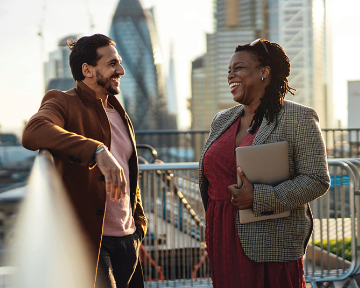 man and woman talking outside