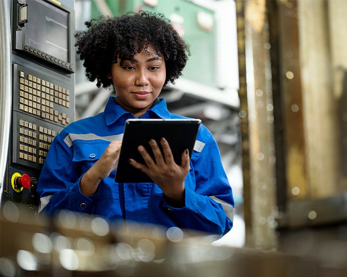 manufacturing employee going through data