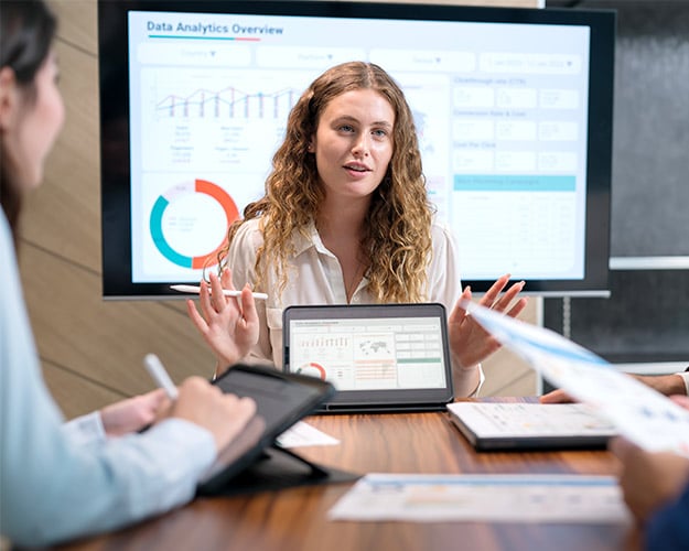 Women going over data while in a meeting.