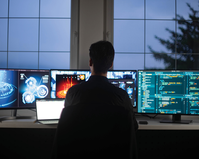 Ominous guy staring at screens