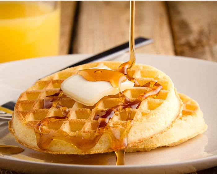 Waffles with butter and syrup