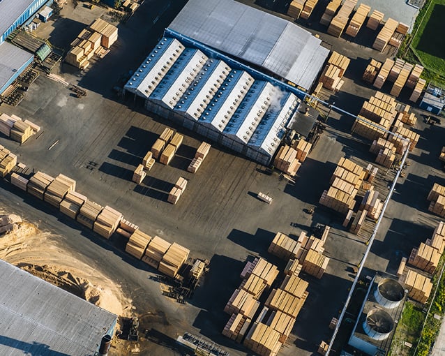 Aerial view of stacked planks in timber yard