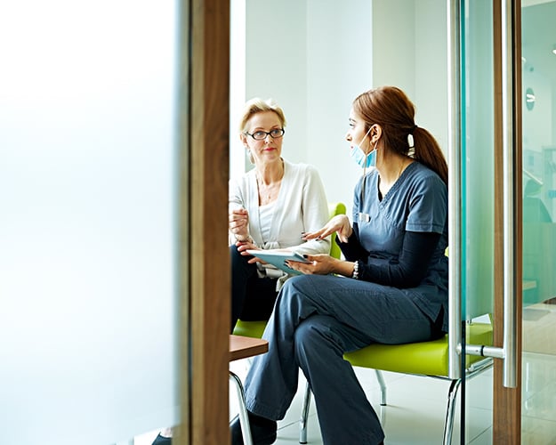Doctor discussing report with a patient