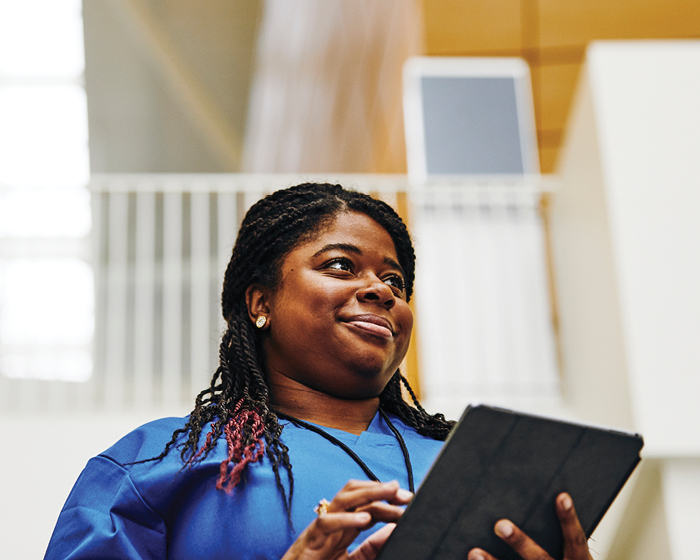 healthcare worker using a tablet