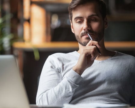 Pensive male thinking over problem solution
