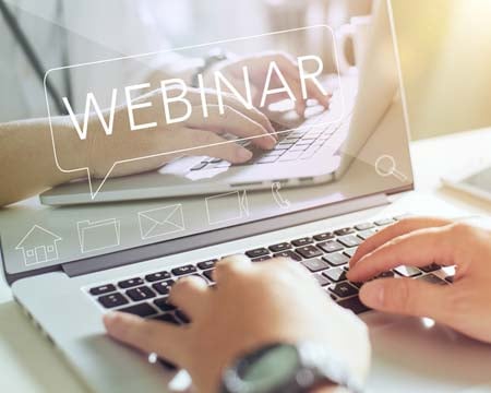 Businessman working on his laptop with webinar
