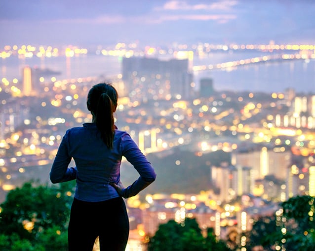 woman looking over city 