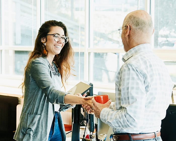 man and woman shaking hands