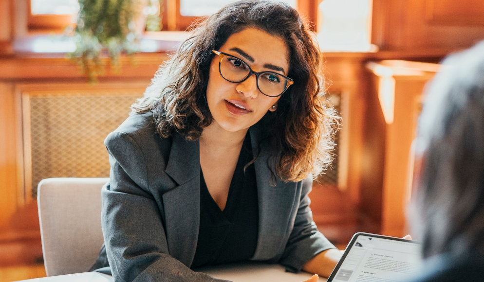 woman in office showing something on a screen