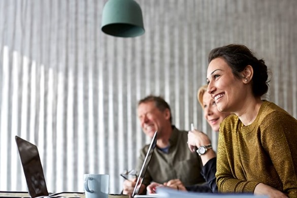 woman smiling while in meeting