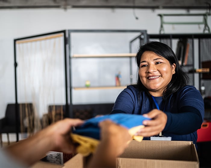 someone donating clothes to a nonprofit organization