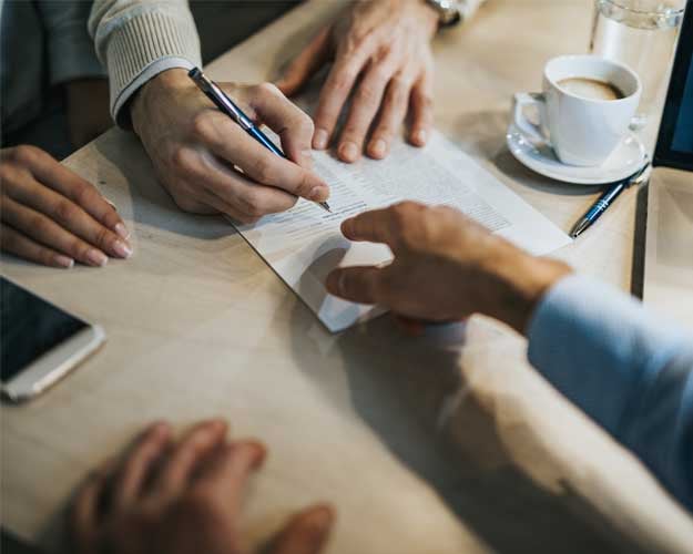 man-signing-a-contract