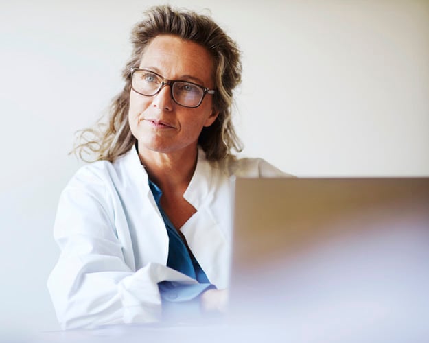 healthcare worker using laptop