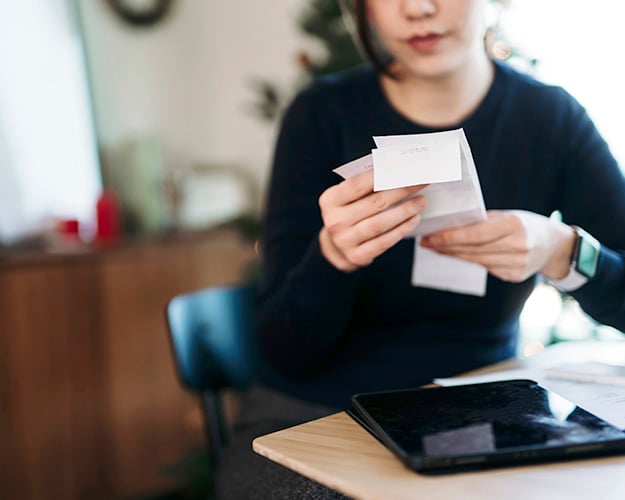 woman with itemized receipt